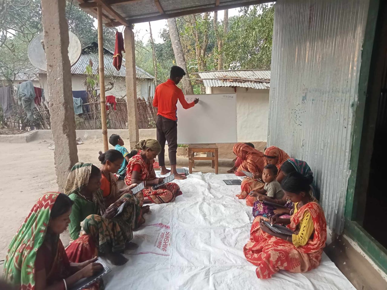 A sponsored student teaches adult learners during an evening session at the Daragaw Leprosy and Disable Development Initiative in Hobigonj, Sylhet, on January 19, 2024.